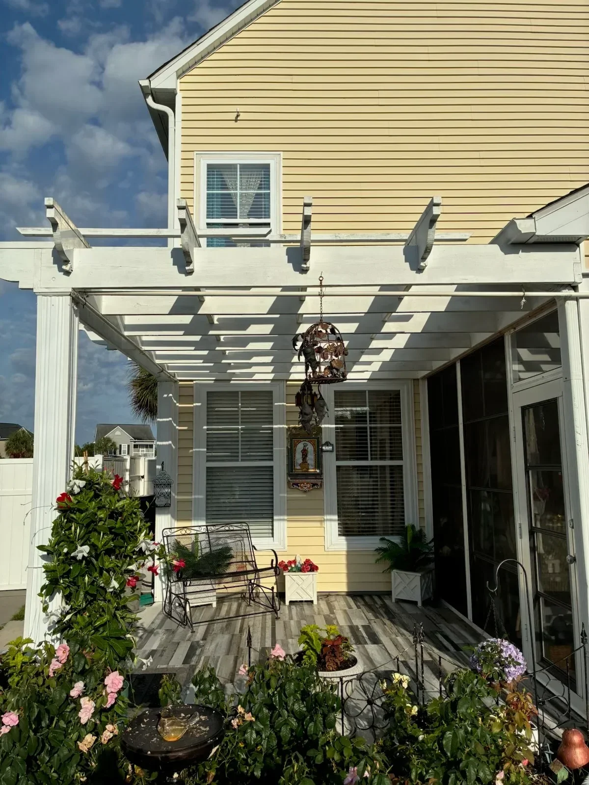 Vertical corrugated metal privacy fence with matching gate and hardware installation