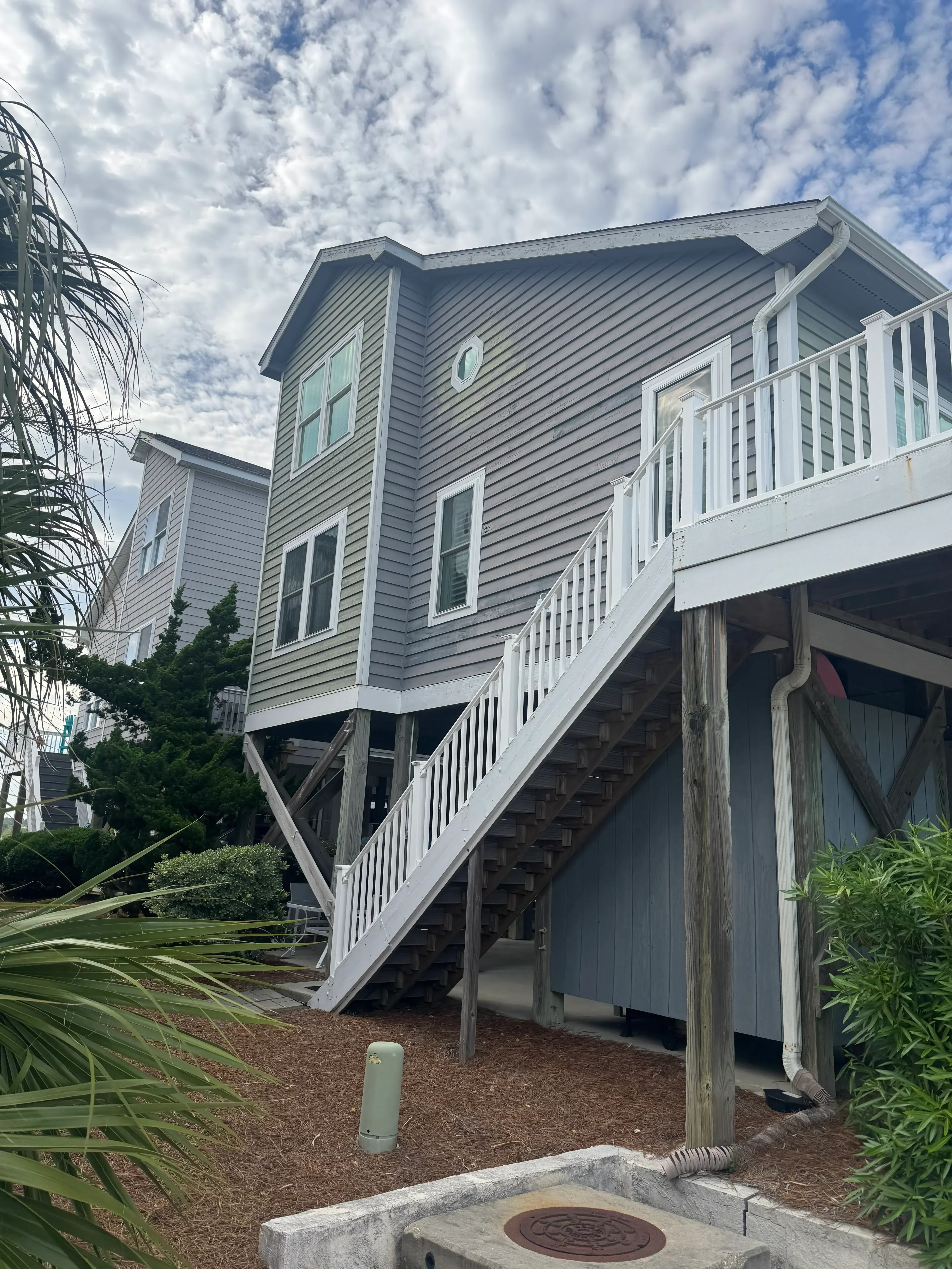 Metal standing seam roof with soffit trim and gutter installation on residential structure